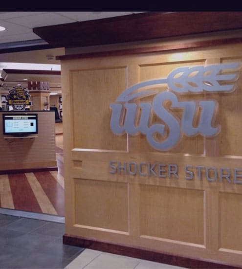 Wichita State bookstore using occupancy counter with TV at entrance